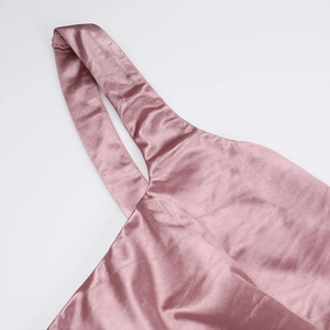 Close-up of high-quality pink satin fabric with neat stitching and glossy silk texture