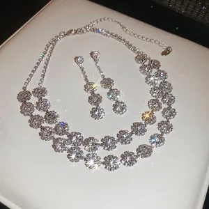 Elegant silver-tone double-layer floral necklace and drop earring jewelry set with crystals