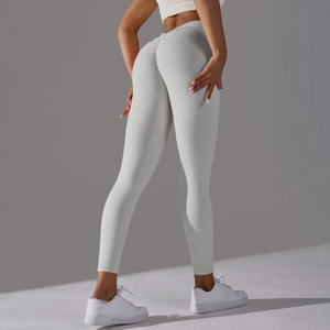Close-up of ruched back seam on light grey high waist yoga leggings for butt lifting