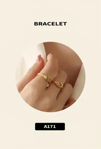 Detailed macro view of 18K gold plated knot ring with vintage matte textured finish