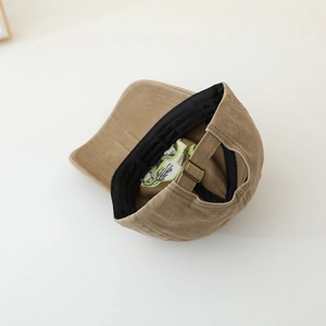 Tan kids baseball cap with adjustable metal buckle and breathable interior mesh detail