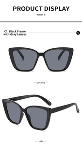 Detailed front and side view of chic black cat-eye sunglasses with grey lenses