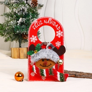 Detail of red Christmas door hanger with plush reindeer and Feliz Navidad greeting