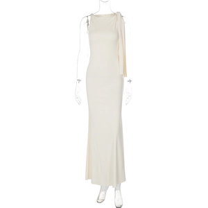Detailed shoulder view showing elegant draped pleats on a cream sleeveless maxi dress