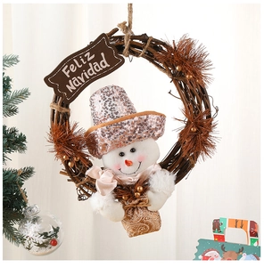 Detail of Christmas snowman wreath with Feliz Navidad wooden sign and golden baubles