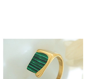 Close-up of gold titanium steel ring with rectangular green malachite inlay