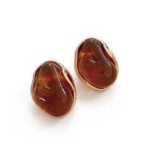 Retro irregular amber resin earrings with 18K gold plated finish for a vintage aesthetic
