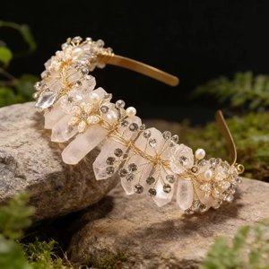 Macro view of crystal crown featuring raw white quartz and pearls on mossy rock