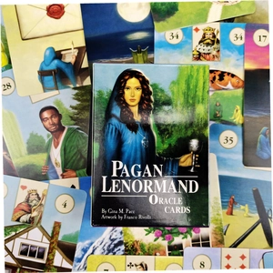 Macro detail of Pagan Lenormand Oracle Cards box with scattered illustrated tarot cards