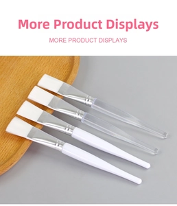 Detail view of four crystal handle facial mask brushes with flat synthetic bristles