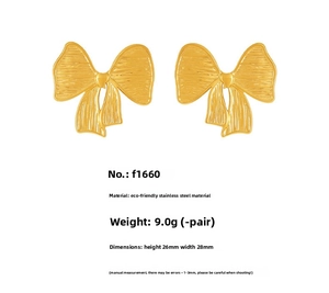 Detailed view of golden bow earrings in stainless steel with size and weight metrics