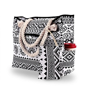 Detail view of canvas tote with rope handle and side pocket for a water bottle