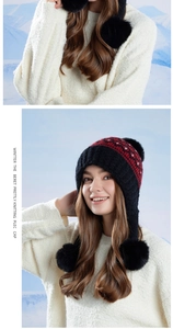 Close-up of Fair Isle knit earflap hat with black pom-poms and warm fleece lining