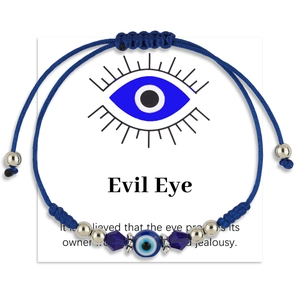 Adjustable evil eye charm bracelet with blue braided cord and silver metal beads