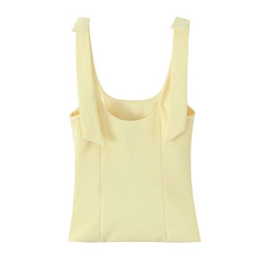 Close-up of pale yellow ribbed knit tank top featuring a bow tie and wide straps