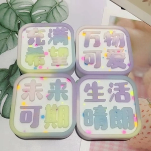 Detailed view of DIY silicone mold crafts with glittery Chinese character plaques