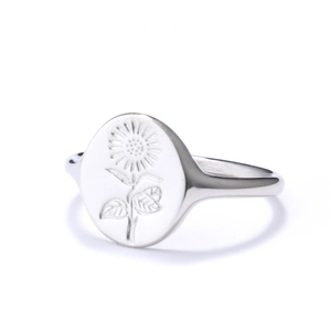 Close-up of engraved sunflower pattern on a polished silver stainless steel ring
