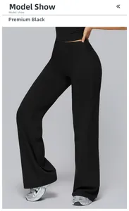 Detail of high-waisted flared yoga pants in premium black with tummy control design