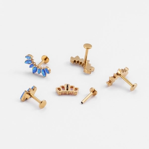 G23 Titanium lip studs set with gold crown design and blue opal stones