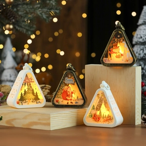 Vintage Christmas LED lanterns with Santa and snowman prints on rustic wooden blocks