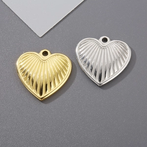 Textured heart-shaped stainless steel pendants in gold and silver finish