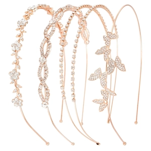 Set of five rose gold bridal headbands with sparkling rhinestones in floral and butterfly designs