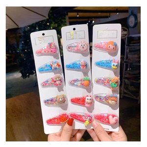 Detailed set of 15 children's hair clips featuring glitter sequins and cartoon figures