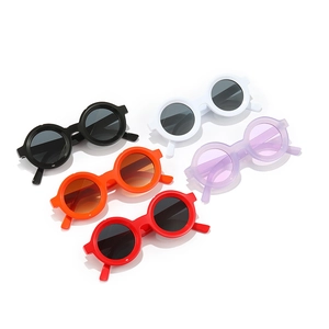Fashionable round frame sunglasses for kids in five vibrant colors displayed on white