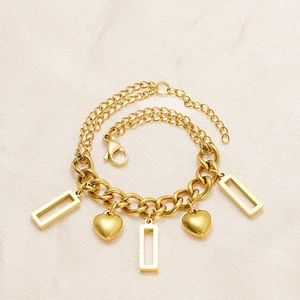 Detailed close-up of 18K gold-plated stainless steel heart and rectangle charms on a chain