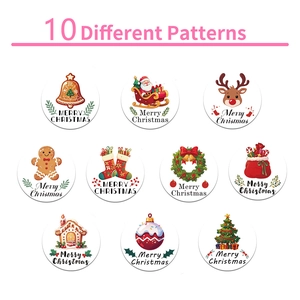 Roll of 500 Christmas stickers featuring 10 assorted festive cartoon holiday designs
