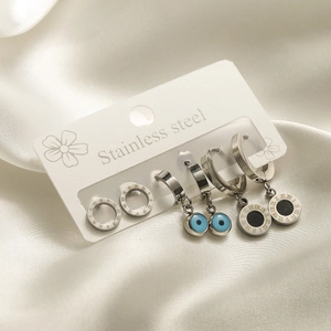 Three-piece stainless steel earring set with evil eye and Roman numeral charms