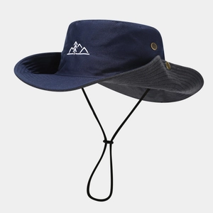 Detail of dark blue outdoor sun hat featuring mountain embroidery and adjustable wind cord