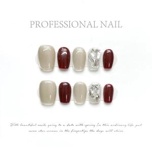Handmade press-on nail set in rose red cat-eye and nude tones with rhinestone accents