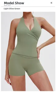 Macro shot of two-piece yoga set in light army green with cross-back bra and high-waist shorts