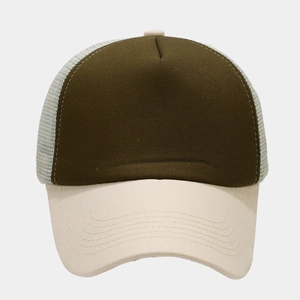 Detail of breathable mesh panel and contrast stitching on a green trucker hat