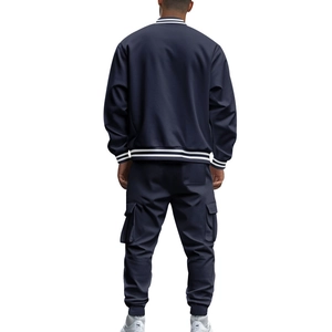 Rear view of men's navy blue baseball jacket and cargo pants with ribbed striped details