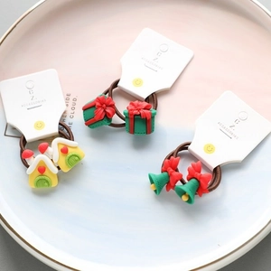 Christmas hair ties set featuring resin Santa, gift box and bell charms for kids