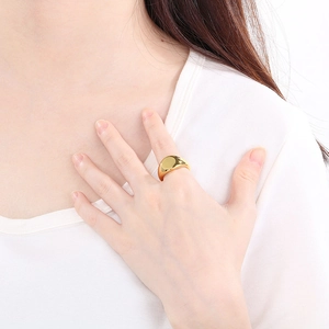 Polished 18K gold plated stainless steel signet ring on finger for a stylish daily look