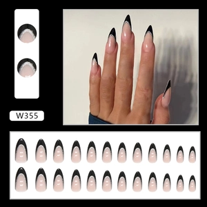Elegant French almond press-on nails with black tips and silver glitter accents.