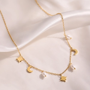 18K gold plated stainless steel celestial necklace with moon stars and pearls on silk