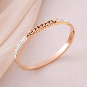 Rose gold stainless steel bracelet featuring center chain motif and paved crystal rows
