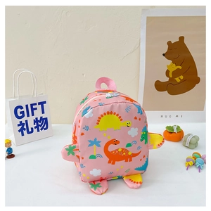 Detail view of pink dinosaur backpack with cartoon prints and creative 3D fin decorations