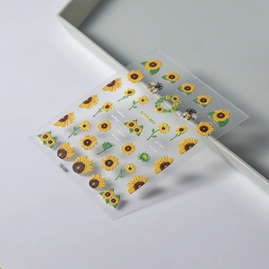Detailed macro view of 3D embossed sunflower and bee nail stickers on TS-233 sheet