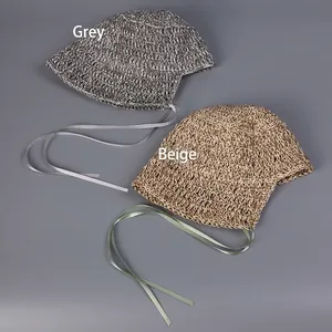 Handmade woven straw sun hat with silk ribbons in gray and beige for summer vacation