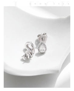 Macro shot of S925 sterling silver water drop earrings with D-color Moissanite stones