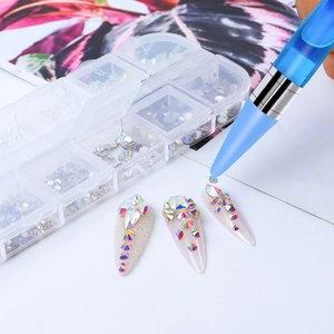 Outil de nail art double embout appliquant des strass AB depuis une boîte de rangement