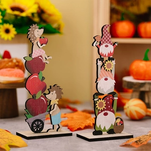 Macro detail of Thanksgiving wooden hedgehog and gnome tabletop ornaments with harvest decor