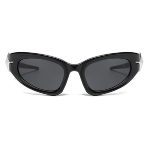 Cyberpunk Y2K cat eye sunglasses in black with silver spiked metal accents on white background