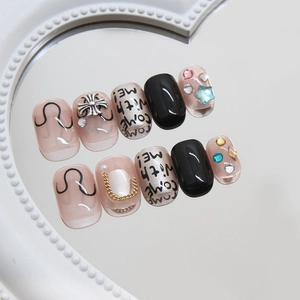 Punk style punk style press-on nails with metal cross charms and letter art on mirror tray