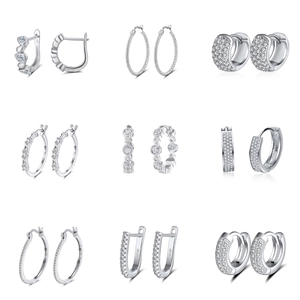 Macro shot of 925 sterling silver hoop earrings with sparkling white cubic zirconia stones